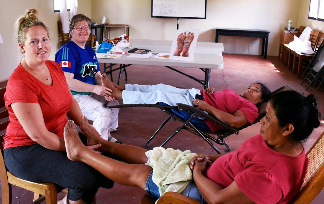 volunteers performing reflexology